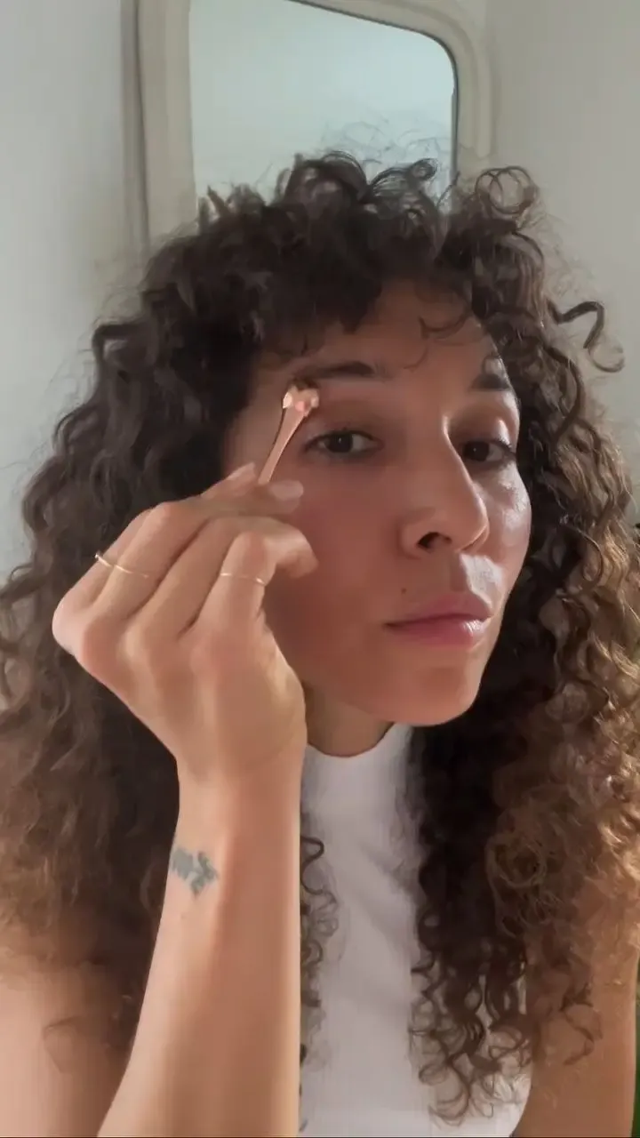 A woman using the Eye Recipe eye contour treatment